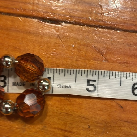 8” stackable stretch bracelet with 8 amber color & 9 silver tone beads - Picture 11 of 13